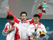 多哈亚运会举重赛次日 丘乐夺得男子62公斤级金牌